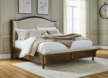 Stuart Furniture Outlet - Ashley Furniture - Sturlayne Bedroom - California King Upholstered Panel Bed / Brown - B787B5