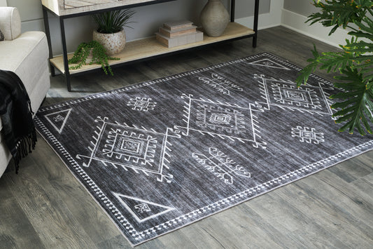 Stuart Furniture Outlet - Ashley Furniture - Arloman Rug - 5' x 7' Washable Rug / Black/Cream/Gray - R405932