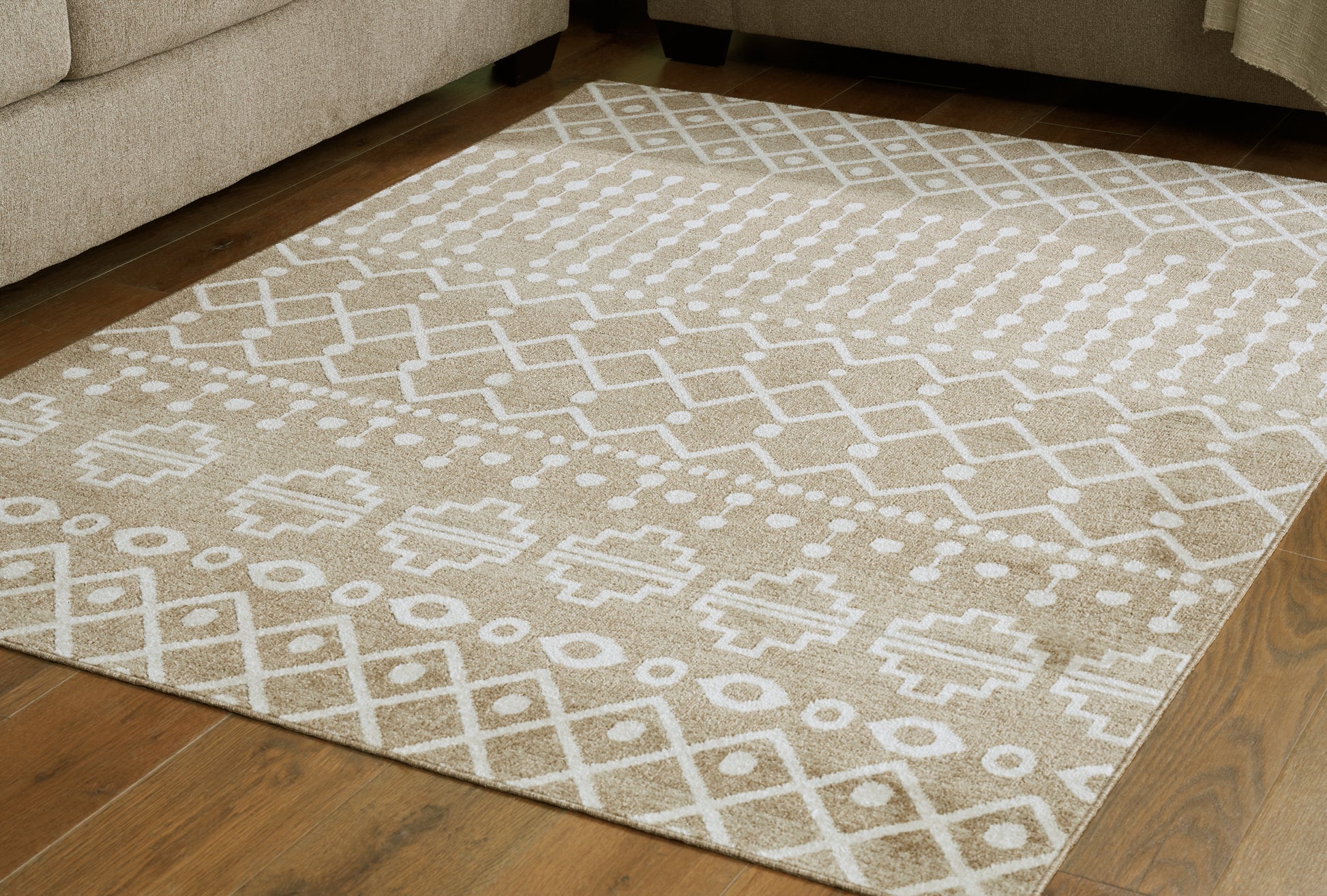 Stuart Furniture Outlet - Ashley Furniture - Bunchly Rug - 4'11" x 7'2" Washable Rug / Tan/Brown/Cream - R406222
