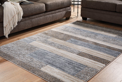 Stuart Furniture Outlet - Ashley Furniture - Sethburn Rug - 5' x 7' Rug / Cream/Brown/Gray - R406592