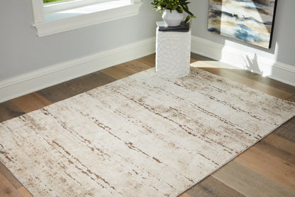 Stuart Furniture Outlet - Ashley Furniture - Kasney Rug - 5' x 7' Rug / Cream/Brown - R406852