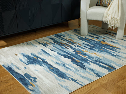 Stuart Furniture Outlet - Ashley Furniture - Vinlett Rug - 5' x 7' Washable Rug / Cream/Blue/Brown - R407042
