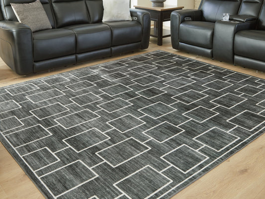 Stuart Furniture Outlet - Ashley Furniture - Elderland Rug - Washable 5' x 7' Area Rug / Black/Gray - R407402