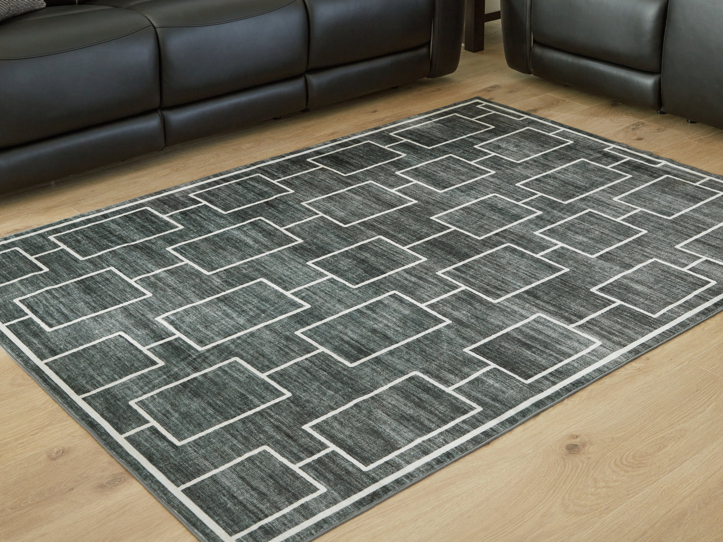 Stuart Furniture Outlet - Ashley Furniture - Elderland Rug - Washable 5' x 7' Area Rug / Black/Gray - R407402