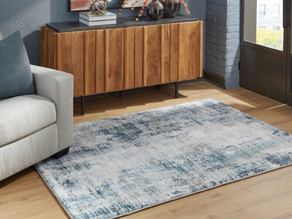 Stuart Furniture Outlet - Ashley Furniture - Arlenmont Rug - 5' x 7' Area Rug / Blue/White/Brown - R407482