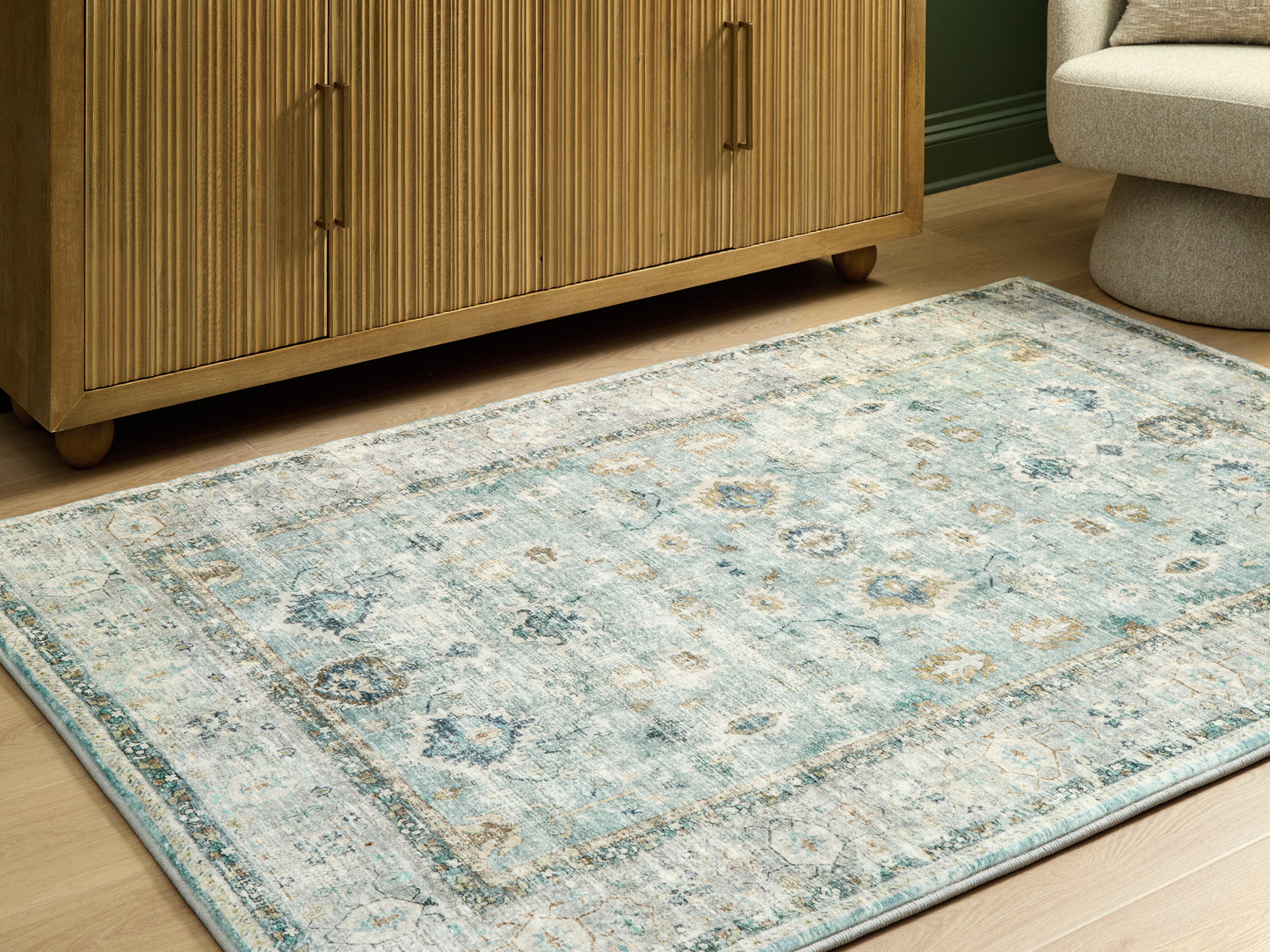 Stuart Furniture Outlet - Ashley Furniture - Ladstoney Rug - 5' x 7' Area Rug / Teal/Beige/Ochre - R407502