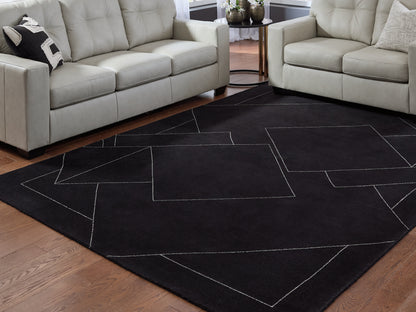 Stuart Furniture Outlet - Ashley Furniture - Marav Rug - 7'8" x 10' Area Rug / Black/White - R407531