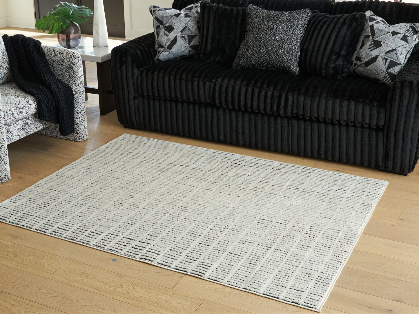 Stuart Furniture Outlet - Ashley Furniture - Turinwith Rug - 5'3" x 7' Area Rug / Ivory/Black - R407552